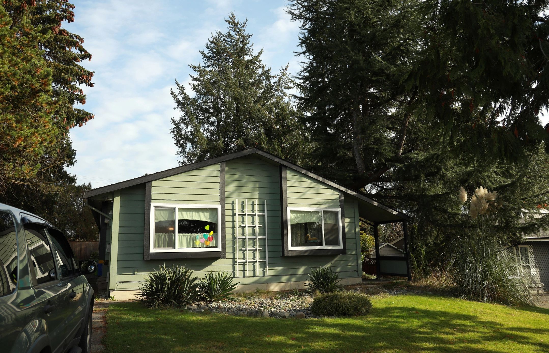 Single-story residential house with front lawn